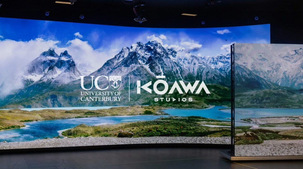An image of the virtual production screen showing a mountain background and the UC Kōawa Studios logos